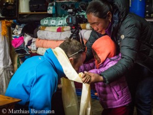 Baumann visiting the family of avalanche victim Chhiring Sherpa 