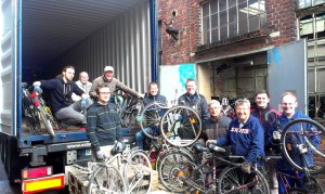 Johannes (left, standing) and his team in front of a container used to ship bikes to Ghana. "Bikes for Africa" already shipped around 800 bikes to Ghana this year (Photo: Ronny Arnold)