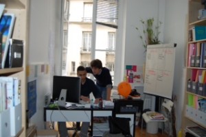 Samuel and a colleague at Coexister's office