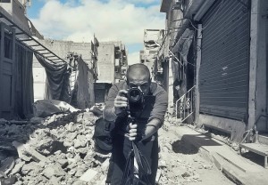 Firas capturing bombed streets on film (Photo: Firas Al-Shater)
