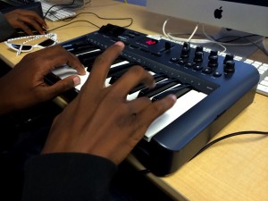 Student Emandre Winston uses the keyboard connected to the music production software at RYSE to work on his own track (Photo: A. Mendelson)