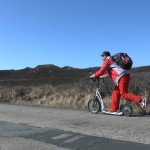 Michael Wigge is riding his scooter on the island of Sylt