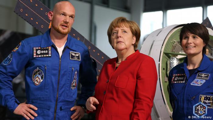 Cristoforetti (R) became a European astronaut in the same year as Alexander Gerst (L), pictured with Chancellor Merkel