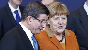 Merkel and Turkish Prime Minister Ahmet Davutoglu during an extraordinary summit of European Union leaders with Turkey at the European Council headquarters in Brussels, Belgium, March 7, 2016. © Imago/Xinhua