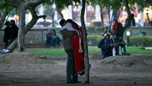  Indian couple hug and chat in a park during Valentine's Day in New Delhi on February 14, 2014. © AFP/Getty Images/P. Singh