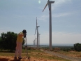 cameraman shooting wind turbines